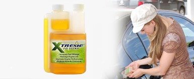 EXTREME FUEL TREATMENT Product and a Woman Putting the Product on Her Car EXTREME FUEL TREATMENT Product and a Woman Putting the Product on Her Car